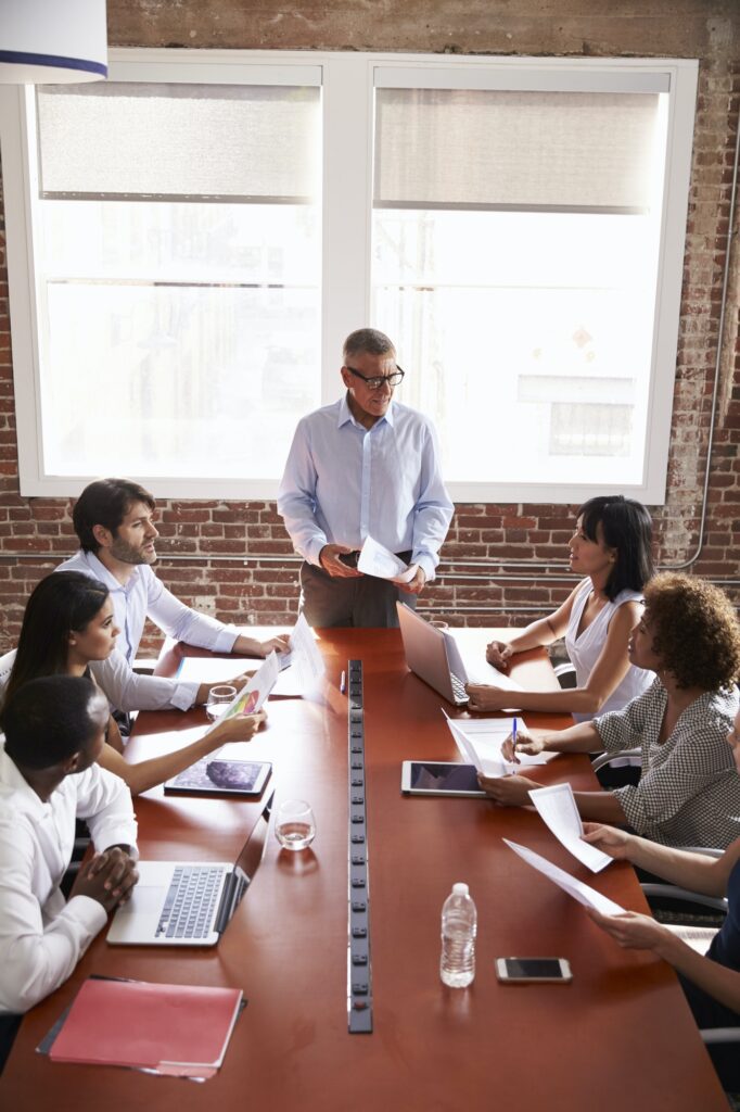 Mature Businessman Addressing Boardroom Meeting
