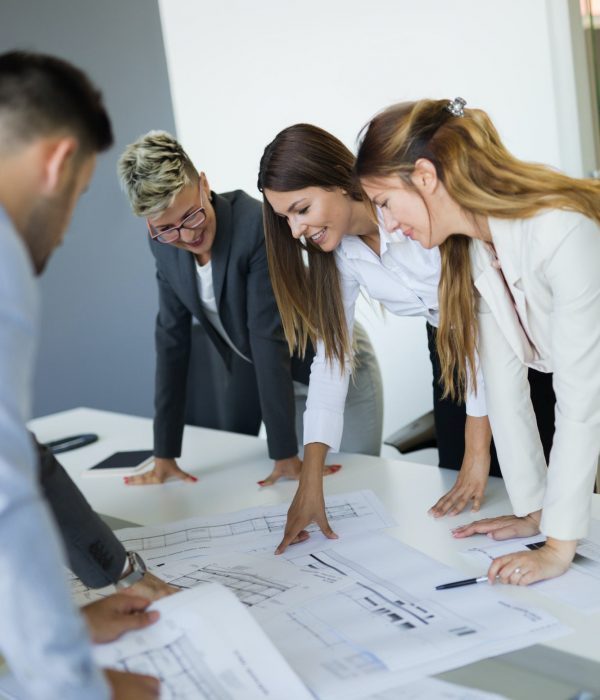 Team of architects working on construction plans